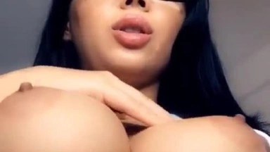Cute black haired babe with amazing and big boobs